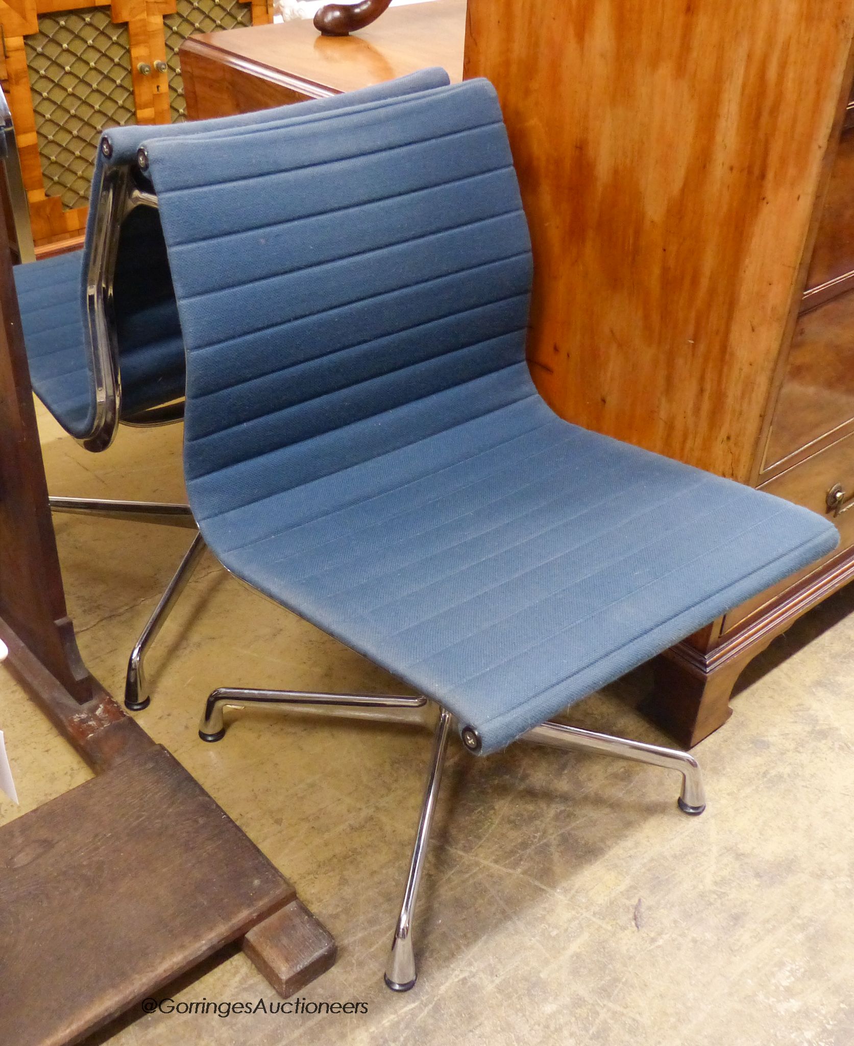 Eames for Vitra. A pair of blue and chrome chairs